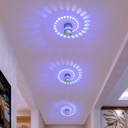 Lythera | Applique LED cilindrica con illuminazione a spirale colorata