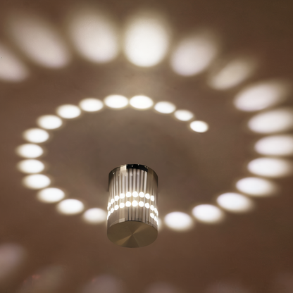 Lythera | Applique LED cilindrica con illuminazione a spirale colorata