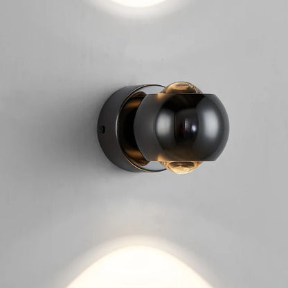 Lampada da parete LED Orbis – Lampada a sfera girevole in nero con orientamento luce a 360°